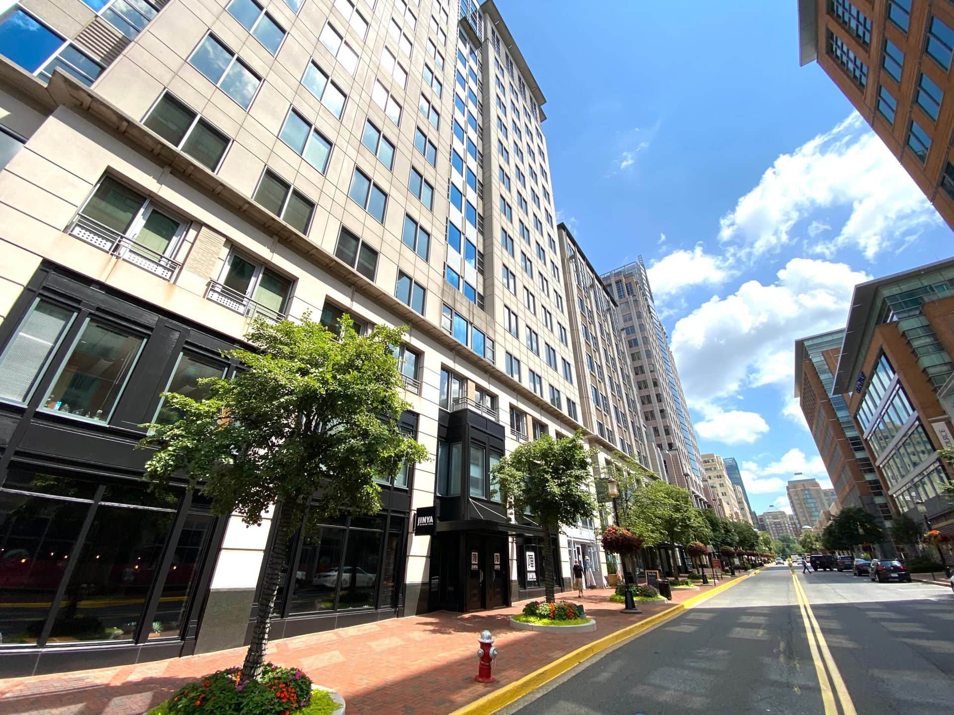 A tree-lined street between mid-rise buildings in Reston, Virginia