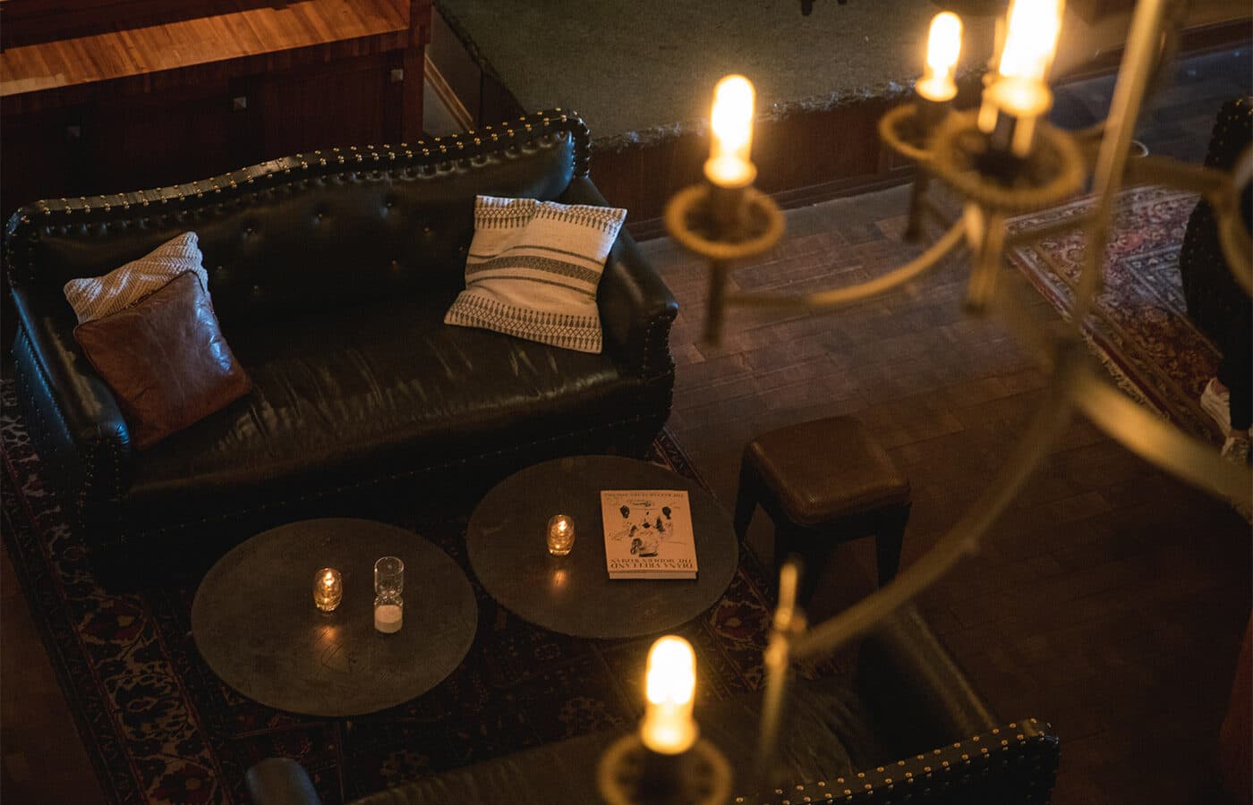 Candlelit leather lounge seating inside The Iron Horse Hotel, Milwaukee, WI
