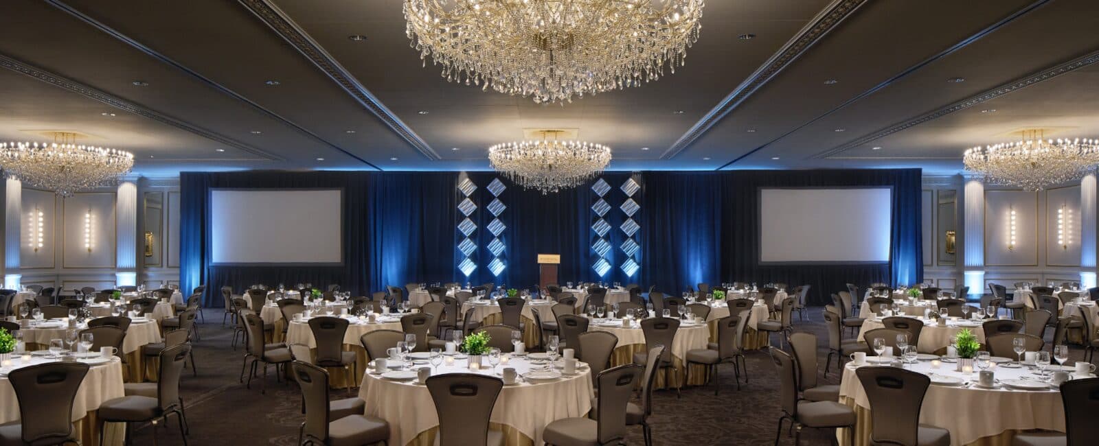 The Pfister Hotel's Grand Ballroom set with round banquet tables under crystal chandeliers, Milwaukee, WI