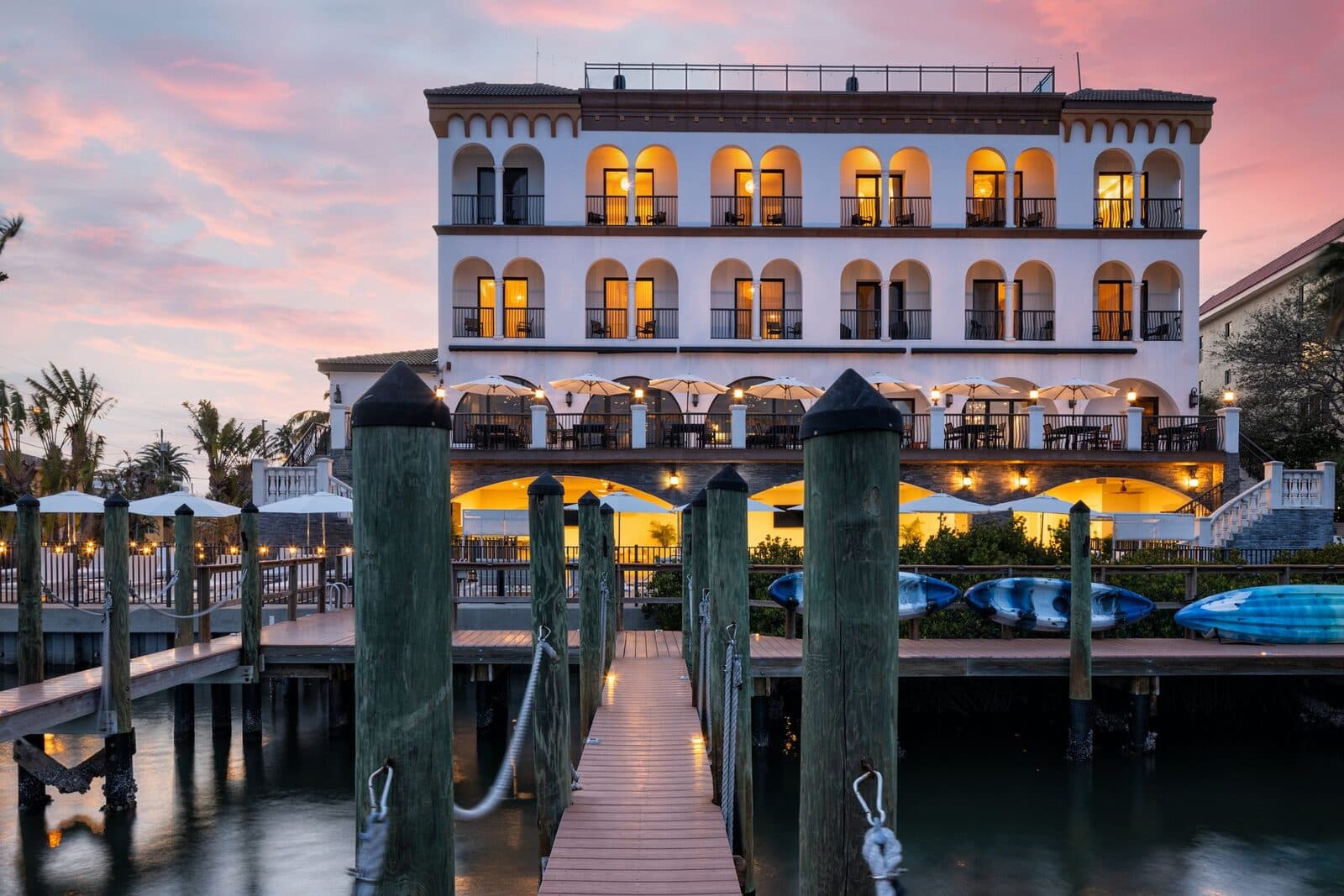 The Hotel Zamora lit at dusk above its dock on the Intracoastal Waterway, St. Pete Beach, FL