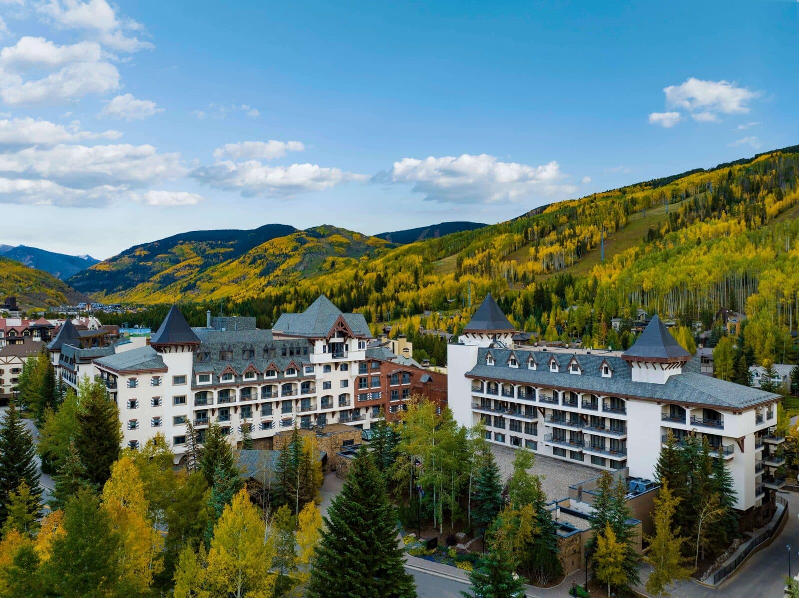 The Hythe's chalet-style buildings in Lionshead against golden fall aspens, Vail, CO
