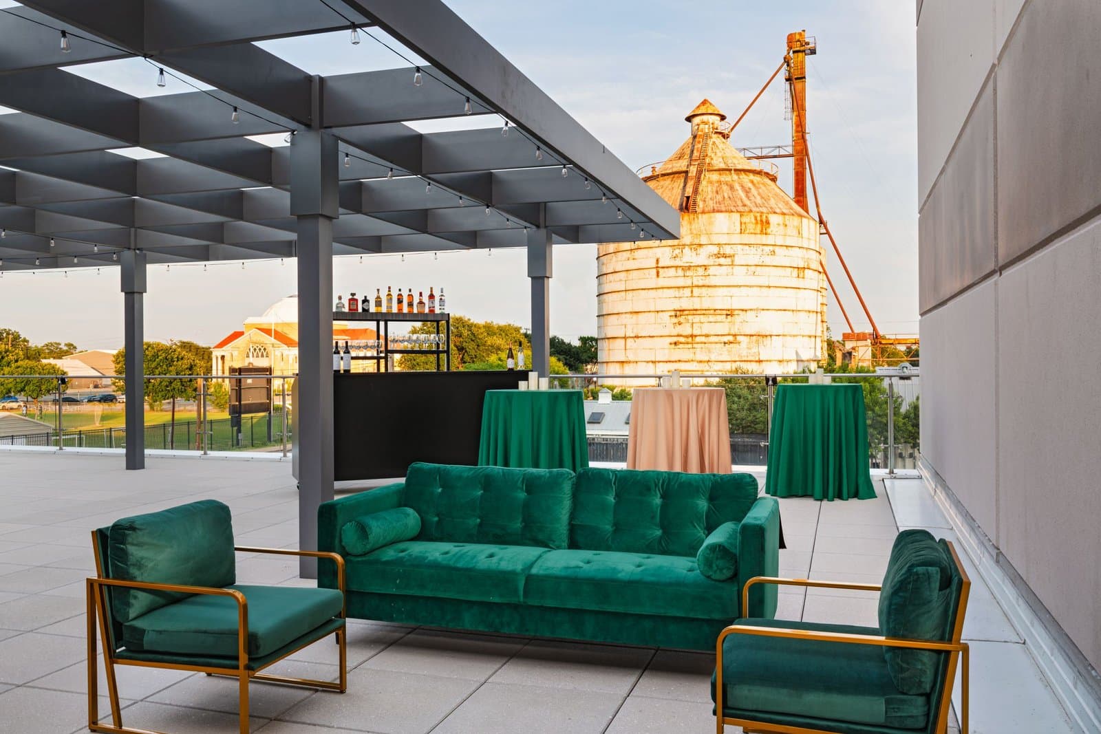 Rooftop Skyline Terrace at AC Hotel Waco Downtown in Waco, Texas, set for a reception with the Magnolia silos behind