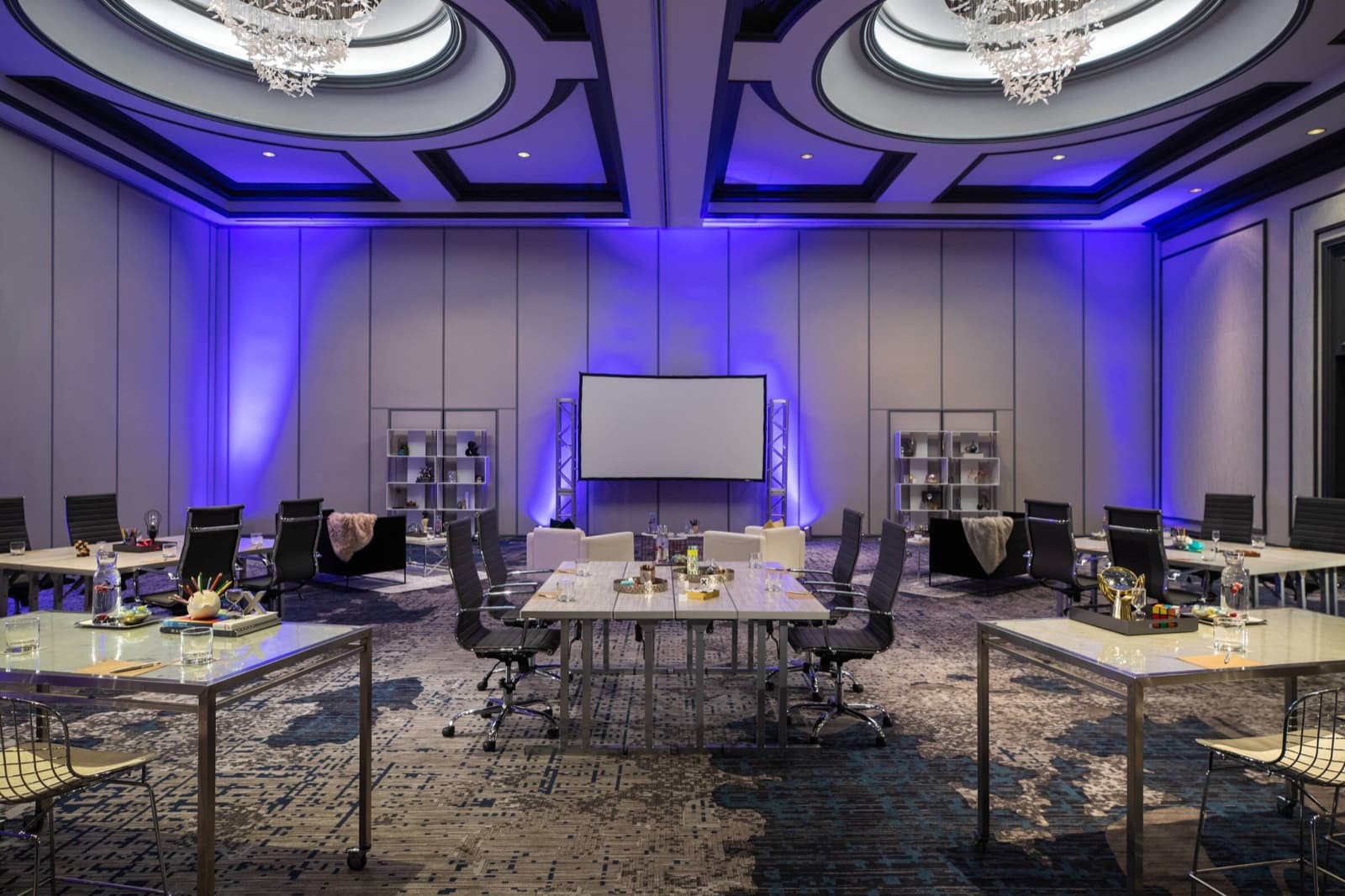 A Renaissance Chicago Downtown ballroom set with workshop tables under blue uplighting