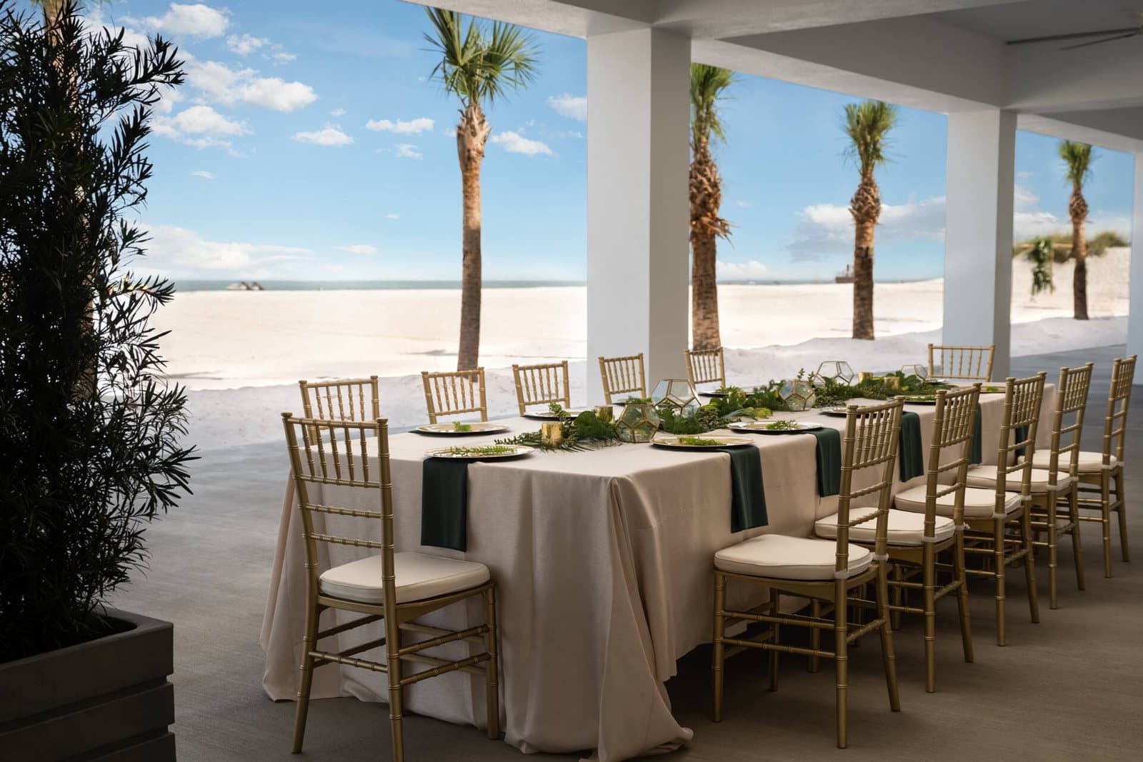 Covered beachfront deck set with a long banquet table at Hilton Clearwater Beach Resort & Spa, Clearwater Beach, FL