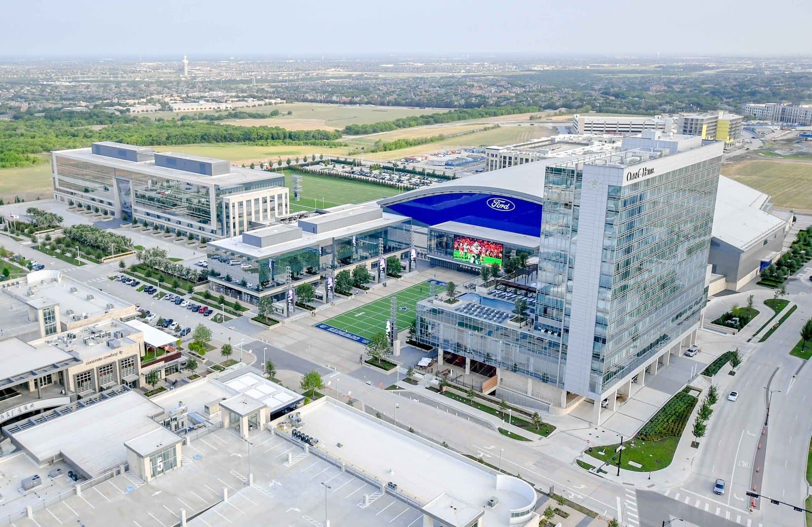 Aerial view of Omni Frisco Hotel at The Star in Frisco, Texas, beside the Ford Center and the Dallas Cowboys practice fields