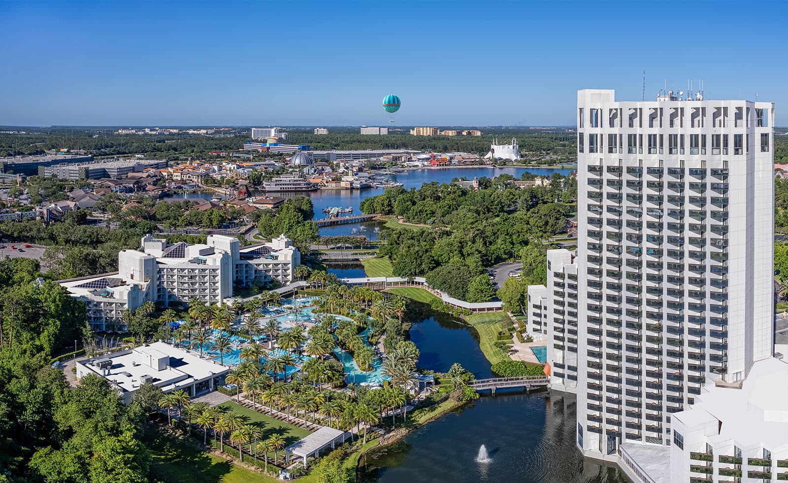 The Hilton Orlando Buena Vista Palace tower and pools from the air, with Disney Springs behind