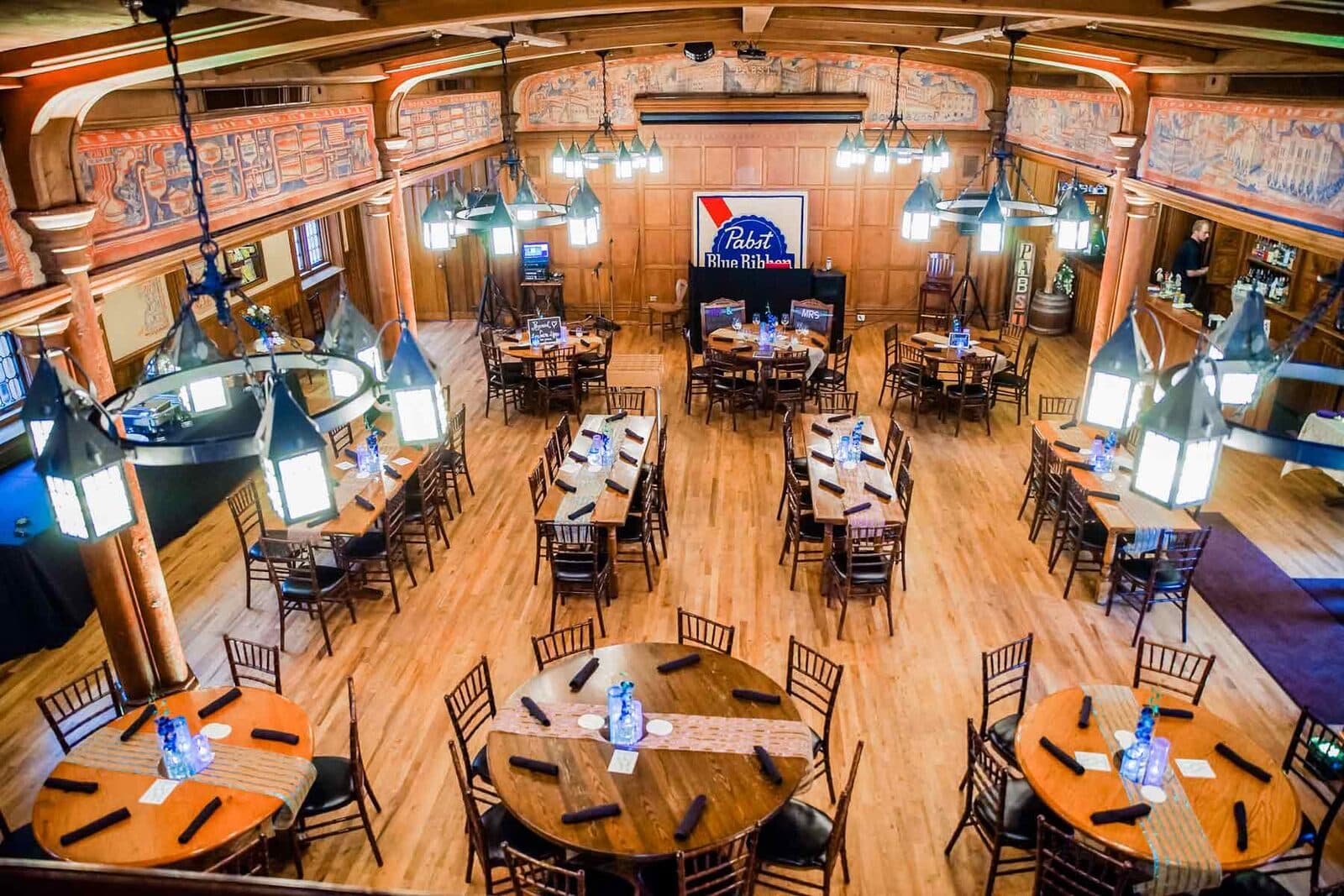 Blue Ribbon Hall at Best Place at the Historic Pabst Brewery set with wooden tables for a group event, Milwaukee, WI