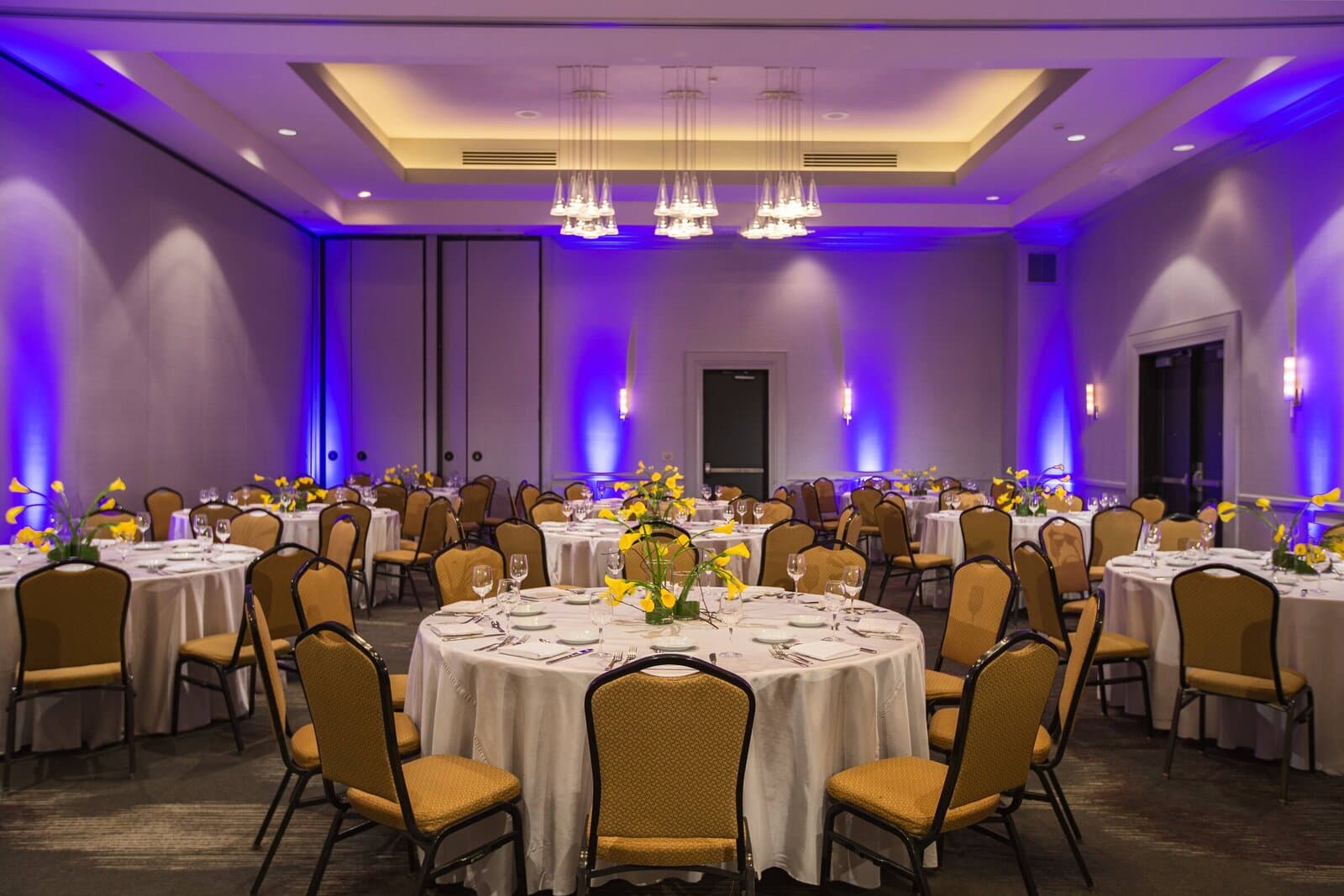 The Renaissance Chicago O'Hare Suites ballroom set with banquet rounds and centerpieces