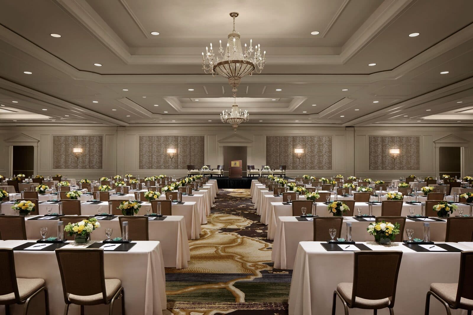 The ballroom at The Ritz-Carlton, Tysons Corner set classroom style under crystal chandeliers, McLean, VA