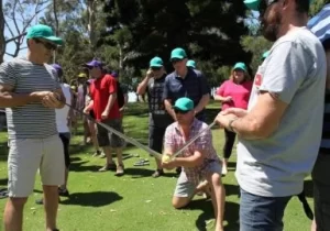 A group of people are playing a game of golf.