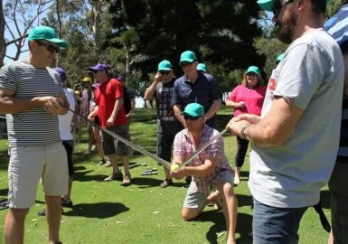 A group of people are playing a game of golf.