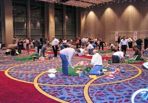 A group of people playing a game of miniature golf.