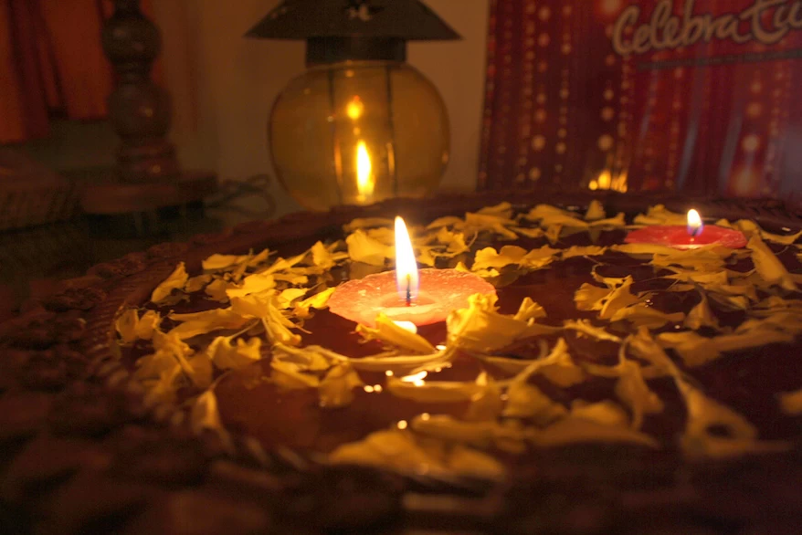 A diwali cake with candles on top of it.