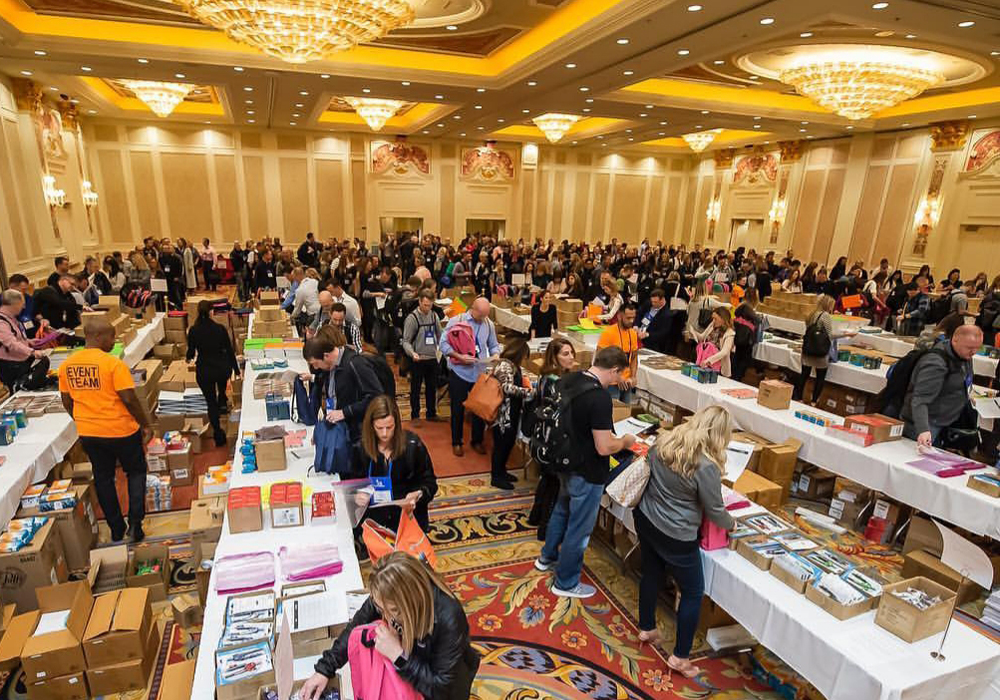 A large room full of people at a book fair.