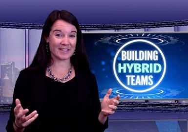 A woman standing in front of a tv with the words building hybrid teams.