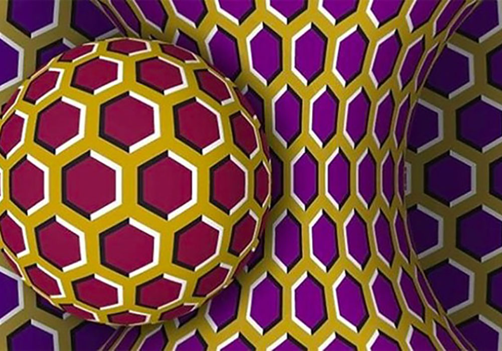 A purple and yellow geometric pattern with a yellow ball.