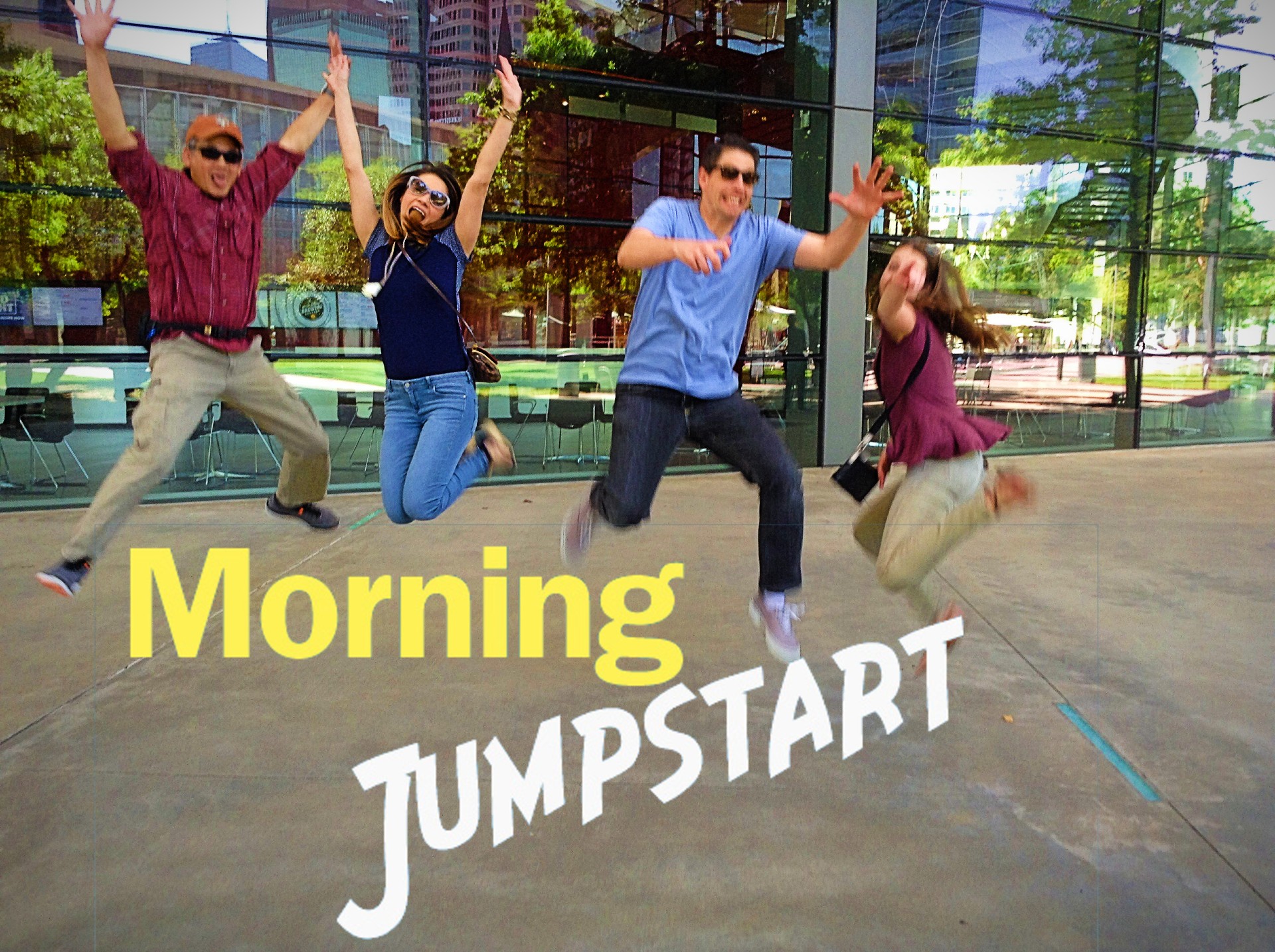 A group of people jumping in front of a building with the words morning jumpstart.