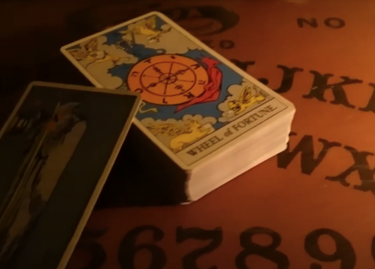 A tarot card is sitting on top of a table.