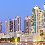 A view of the miami skyline at dusk.