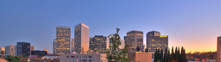 A view of a city skyline at dusk.