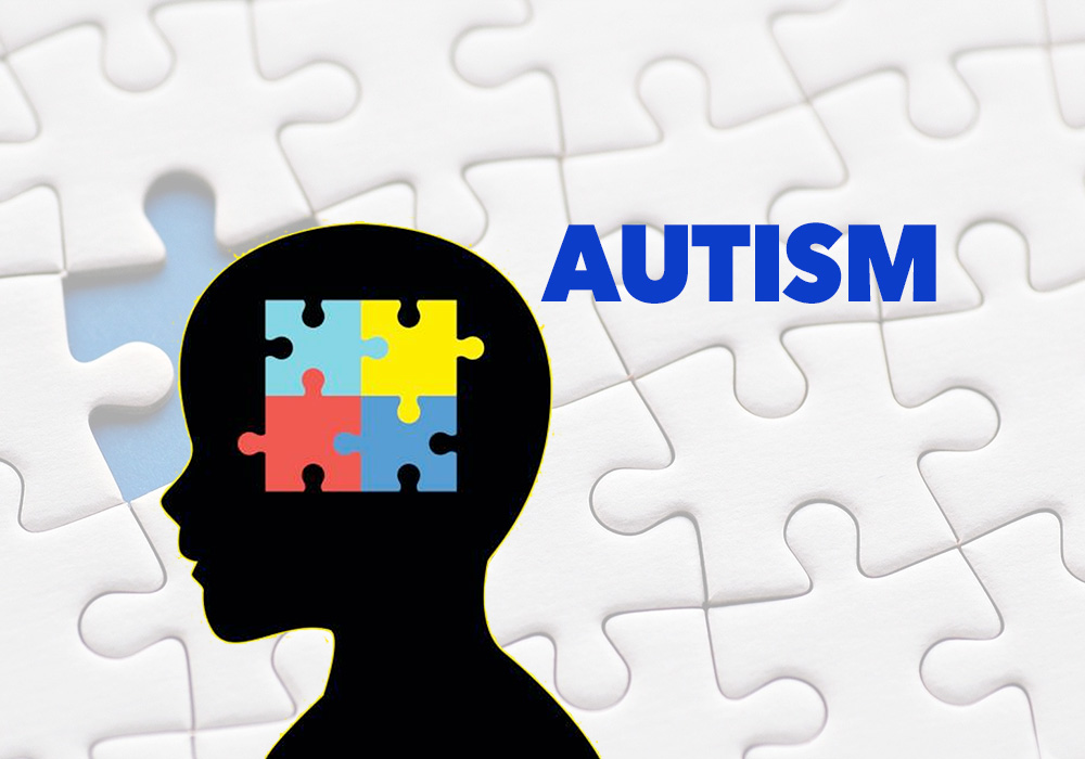 A silhouette of a person with autism in front of a jigsaw puzzle.