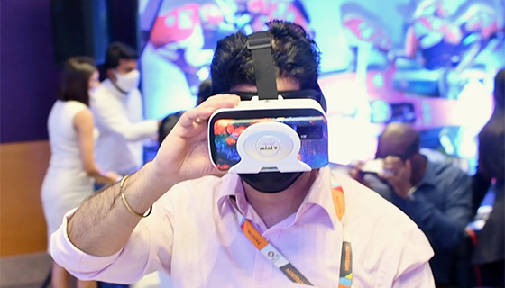 A man wearing a vr headset at an event.