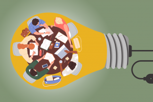 Top-down view of a diverse team demonstrating dynamic interactions, seated around a table cluttered with laptops, notebooks, and coffee mugs, symbolized as being inside a light bulb.