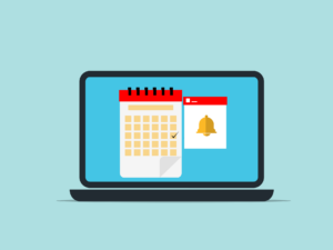 A laptop screen displays a calendar with a checkmark next to a notification icon featuring a bell on a blue background.