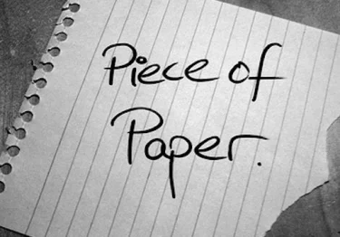 A piece of paper with the word piece of paper written on it.